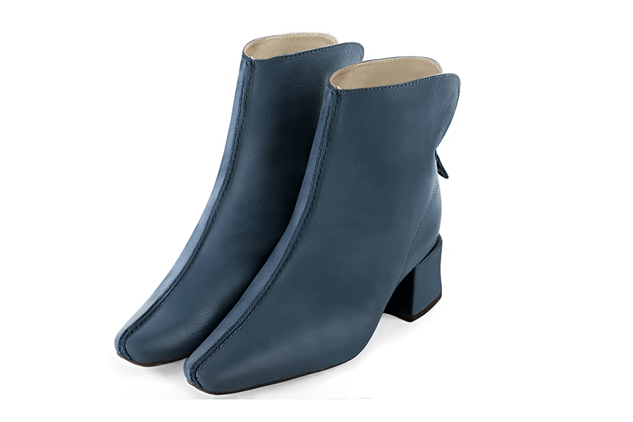 Denim blue women's ankle boots with a zip at the back. Square toe. Medium block heels. Front view - Florence KOOIJMAN